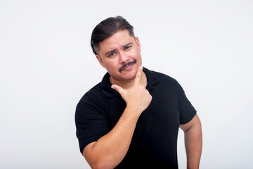 A stocky middle aged man with a mustache and of mixed race bragging about his looks while looking...
