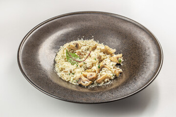 delicious risotto with mushrooms in bowl. Rice porridge, italian cuisine. Menu, recipe mock up, banner. top view