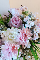 Bouquet in a basket. The concept of decorating cafes and premises. Flowers for holidays and weddings.