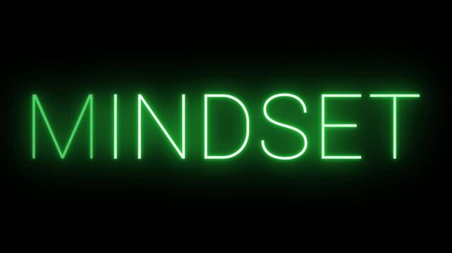 Flickering neon green glowing mindset text animated on black background