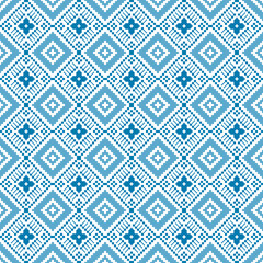 Seamless blue and white pixel art pattern arranged in a repeating geometric pattern. This vector illustration is perfect for use in winter themed projects, textiles, digital artwork, and home decor
