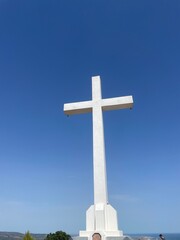Big jezus cross with blue sky © Ella