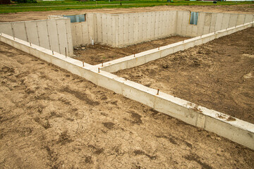 Concrete footings and basement in place, ready for next phase of construction of new home.