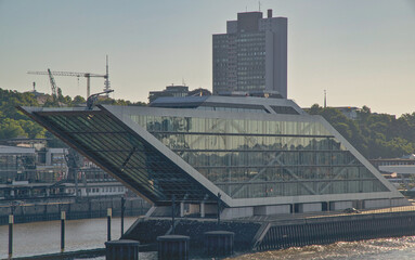 View onto downtown Hamburg, Germany cityscape city skyline from River Elbe with historic and modern architecture facade buildings, harbor port promenade and marine traffic