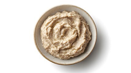 Fototapeta premium Creamy hummus in rustic ceramic bowl on white background for healthy snacking