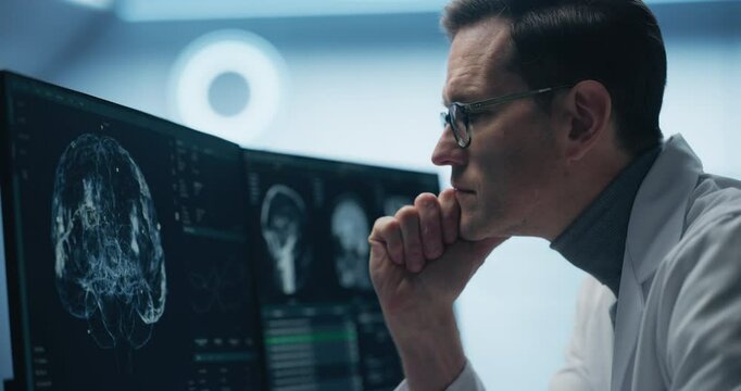 Neurologist Examines Intricate Brain Scans on Multiple Screens. Advanced Neuroimaging Technology Reveals Complex Neural Pathways, Display Showing CT Scan in a Modern Medical Environment.
