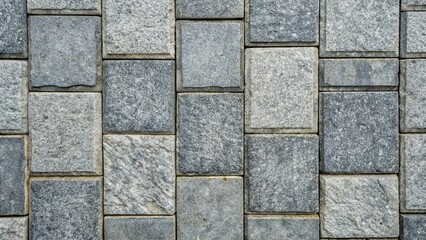 Fototapeta premium Granite gray flagstone pavement wall background seen from a bird s eye view, wall, pattern, surface, landscaping, pathway, pavement, texture, design, pavement, flagstone, architecture