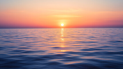Fototapeta premium Sunrise over a calm ocean horizon 