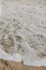 Beach, Sand, Waves. Waves breaking on the beachfront and forming incredible textures