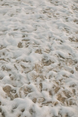 Beach, Sand, Waves. Waves breaking on the beachfront and forming incredible textures
