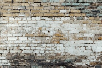 Weathered Brick Wall with White Paint