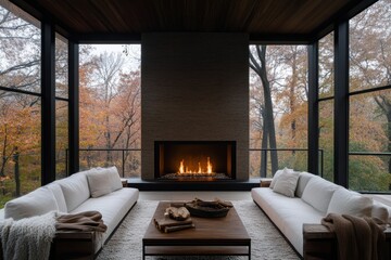 Fototapeta premium Minimalist living space showcasing a sleek fireplace, ivory sectional sofas, floor-to-ceiling windows, and serene woodland views creating a tranquil and serene atmosphere.