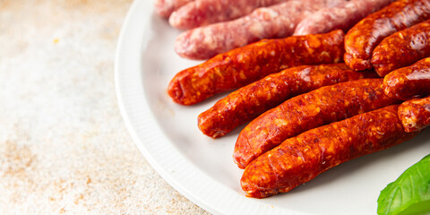 raw sausages beef, pork, chicken, lamb, dish fresh delicious gourmet food background on the table rustic food top view copy space