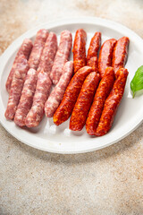 raw sausages beef, pork, chicken, lamb, dish fresh delicious gourmet food background on the table rustic food top view copy space