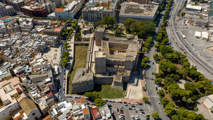 Fototapeta premium Aerial view of the Norman-Swabian castle in the historic center of Bari, Puglia, Italy. The imposing fortress, symbol of the city of Bari, is located on the edge of the old town near the port.
