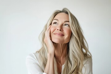 Fototapeta premium Beautiful blond hairdo elder lady's hands and chin look empty without clothes against white background
