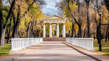 Obraz premium On a beautiful sunny day, a small white pavilion stands amid vibrant autumn trees, inviting visitors along a cobblestone path through the colorful landscape