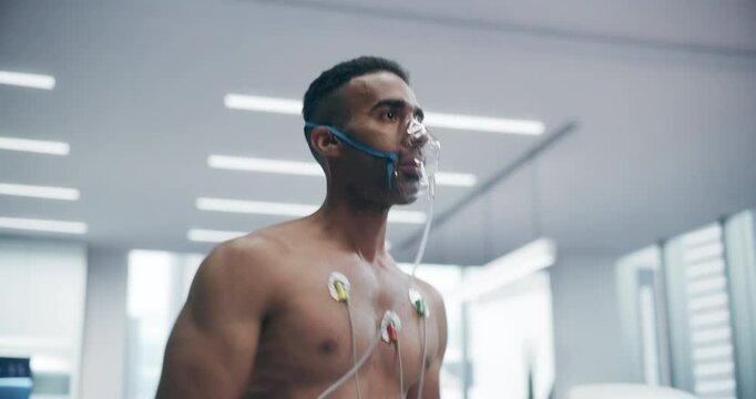 Athlete Wearing Oxygen Mask for a Treadmill Exercise Test in a Laboratory, Monitored by Sensors and Breathing Apparatus, Showcasing Fitness Assessment and Health Monitoring in a Controlled Environment