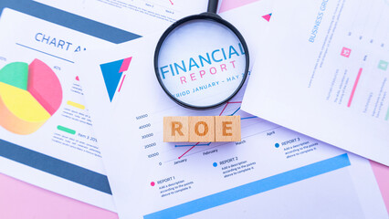 Wooden cube with the word ROE. It is an abbreviation of Return on Equity. Business profitability success growth profitability analytics. Business and financial market concept.