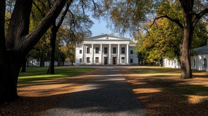 Obraz premium On a beautiful sunny day, a small white pavilion stands amid vibrant autumn trees, inviting visitors along a cobblestone path through the colorful landscape