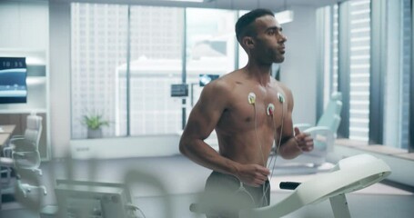 Male Athlete Running on Treadmill doing Exercise Test in a High-tech Medical Lab, Monitored by Sensors, Highlighting Advanced Fitness Evaluation and Health Monitoring Under Physician Supervision.