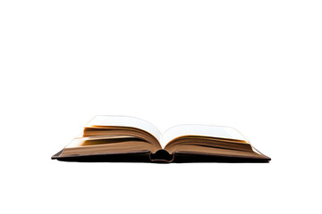 Naklejka premium An open book lying on a polished wooden table , isolated on white background