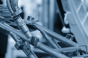 The high technology laser welding process by robotic system in automotive factory.