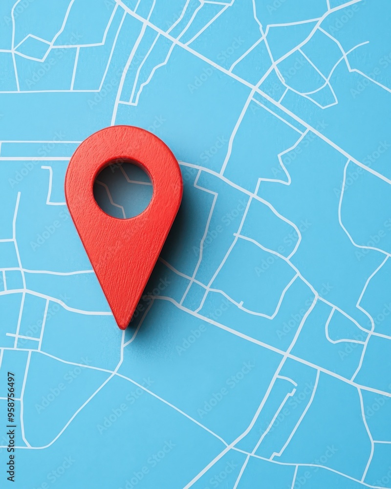 Poster a vibrant red location pin on a blue map background, symbolizing navigation and direction for digita