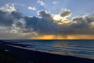 Fingers of light over the Tasman Sea, New Zealand