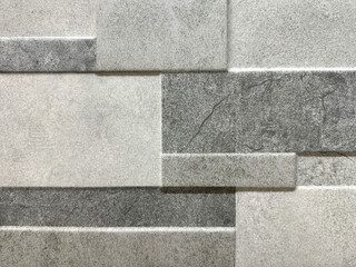 Natural random rectangular cut cobblestone brick style texture with brown and grey earth tone colors.