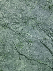 Close up texture and pattern of Green Jade Marble, or Emerald Marble, contemporary exotic natural marble commonly from China. Seamless background, luxurious marble.