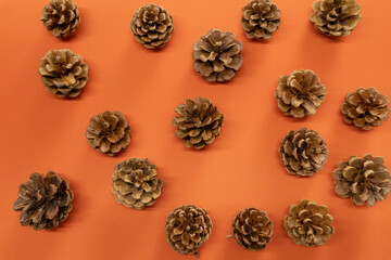 Halloween background - Cones on bright orange background. Halloween Atmosphere.
