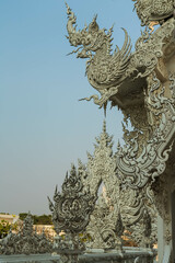 Fototapeta premium Chiang Rai, Thailand - March 2020: Part of the exterior of White temple or Wat Rong Khun. Details