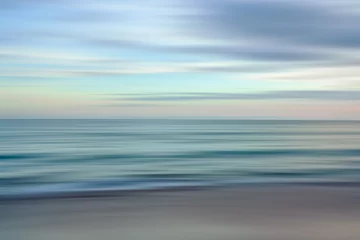Stickers Ziekenhuis Ethereal waves flow in a blurred dance of blues and oranges in a serene seascape  © Hanna Tor