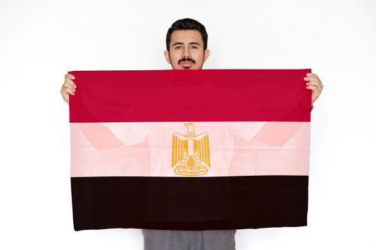Young man holding Egypt flag, celebration or campaigning concept, independence day idea, two hands 