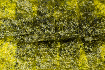 Tasty nori seaweed as a background. Top view.