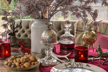 Christmas table decorations with baubles and candles