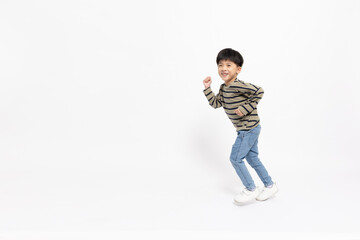 Asian little boy running isolated on white background, Full body composition and five years old © comzeal