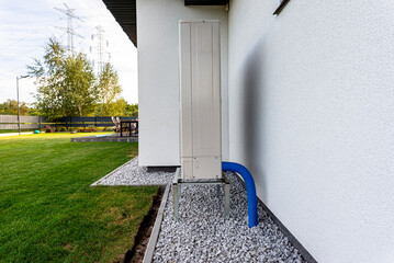 Two efficient outdoor heat pump units placed in front of the house.