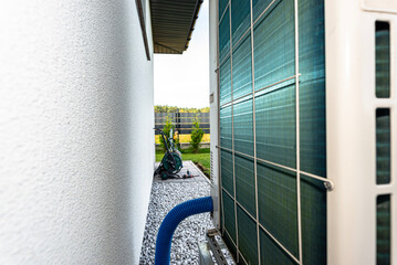 Two efficient outdoor heat pump units placed in front of the house.
