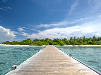 jetty to a beautiful tropical beach on the maldives