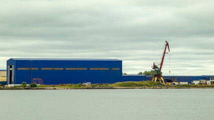 A large cargo sea vessel is at anchor, a dry cargo ship is at anchor