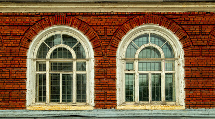 Barred windows of an abandoned mental hospital