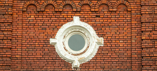 Barred windows of an abandoned mental hospital