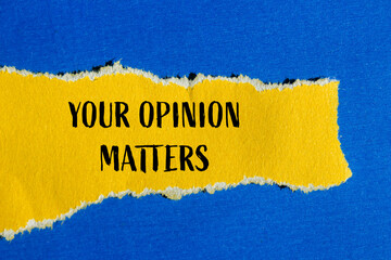 Your opinion matters message written on ripped torn yellow paper with blue background. Conceptual your opinion matters symbol. Copy space.