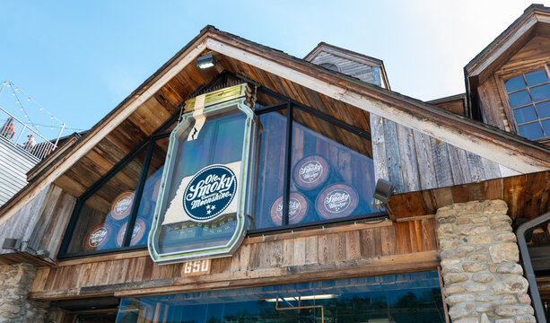 GATLINBURG, TN - 12 MAR 2024: Ole Smoky Moonshine building and sign above the front entrance, from street view.