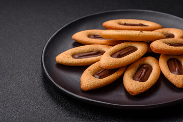 Delicious sweet crispy cookies with chocolate filling in the center