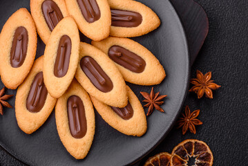 Delicious sweet crispy cookies with chocolate filling in the center