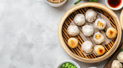 Flat lay of a Chinese dim sum platter with an assortment of dumplings. Copy space included.