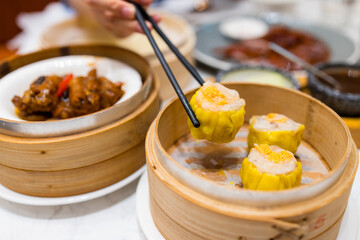 Cantonese style dim sum with steamed shumai in basket